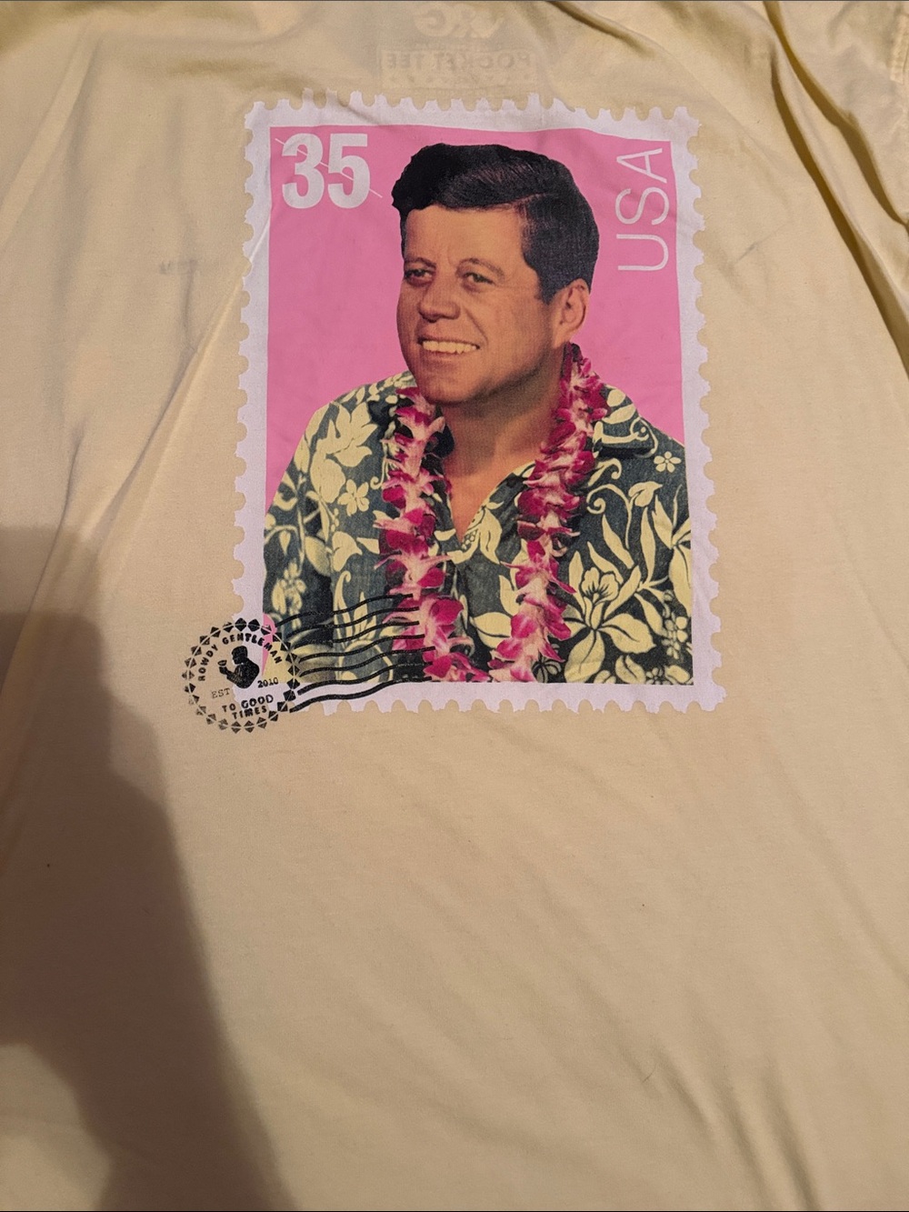 ROWDY GENTLEMEN JFK Men's Cream Graphic Tee with Pink Stamp Print
